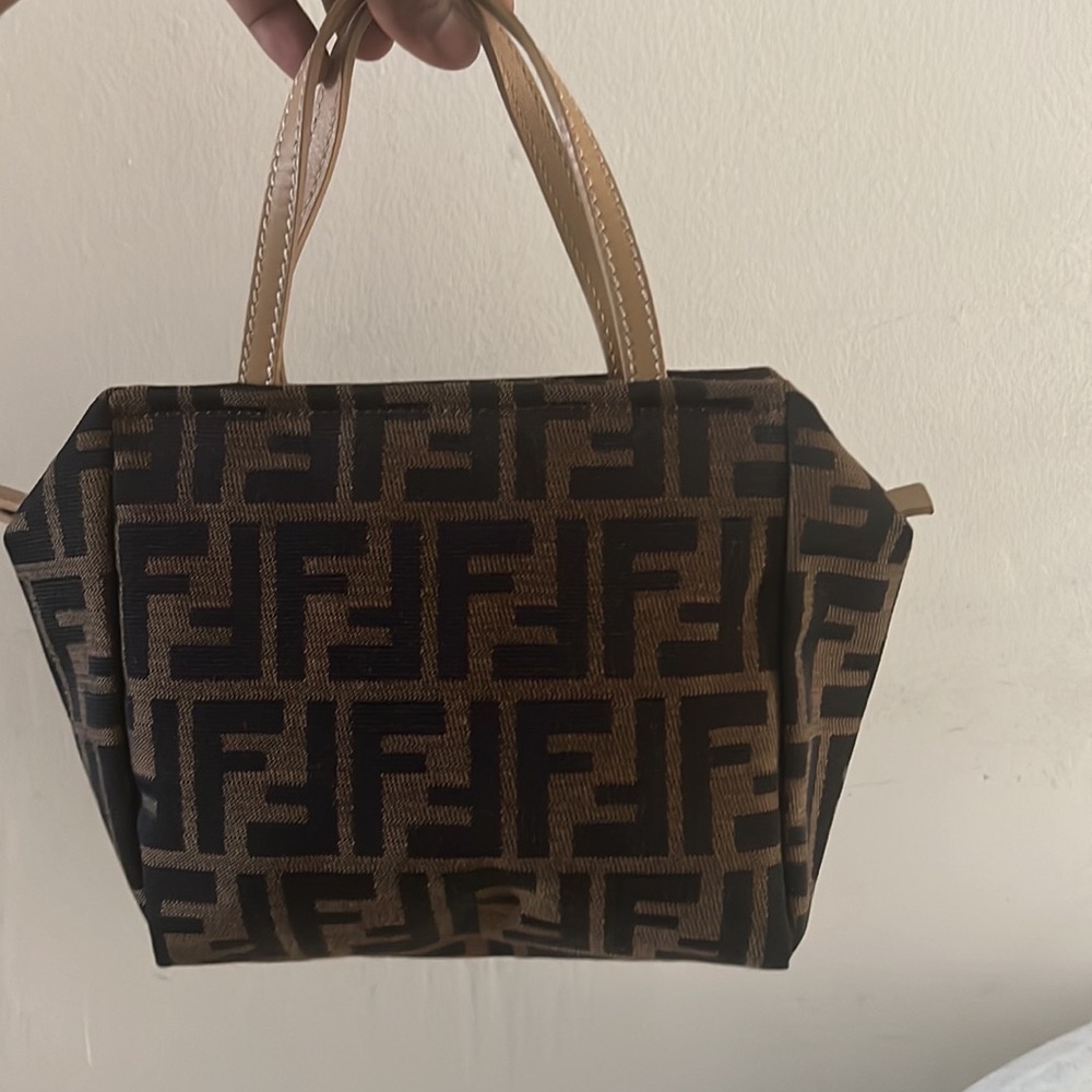 Cute mini bag, cute for a date or going out. Small but u can fit your phone
